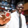 Man-Holding-Stethoscope